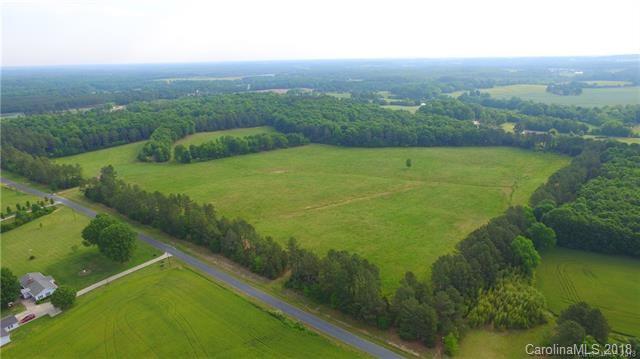 0 Macedonia Church Road, Unit 3 Monroe, NC 28112 - Photo 1 of 9 a view of a green yard with large trees