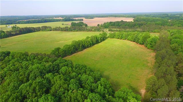 0 Macedonia Church Road, Unit 3 Monroe, NC 28112 - Photo 5 of 9 a view of a lake with a city