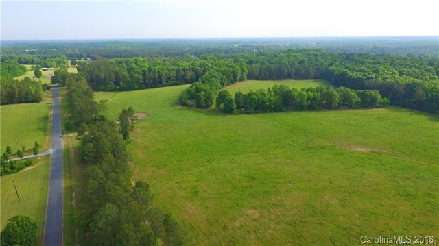 0 Macedonia Church Road, Unit 3 Monroe, NC 28112 - Photo 6 of 9 a view of a lush green outdoor space with a lake view