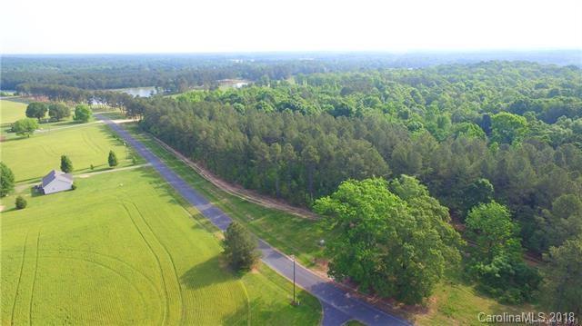 0 Macedonia Church Road, Unit 3 Monroe, NC 28112 - Photo 7 of 9 an aerial view of residential houses with outdoor space and trees