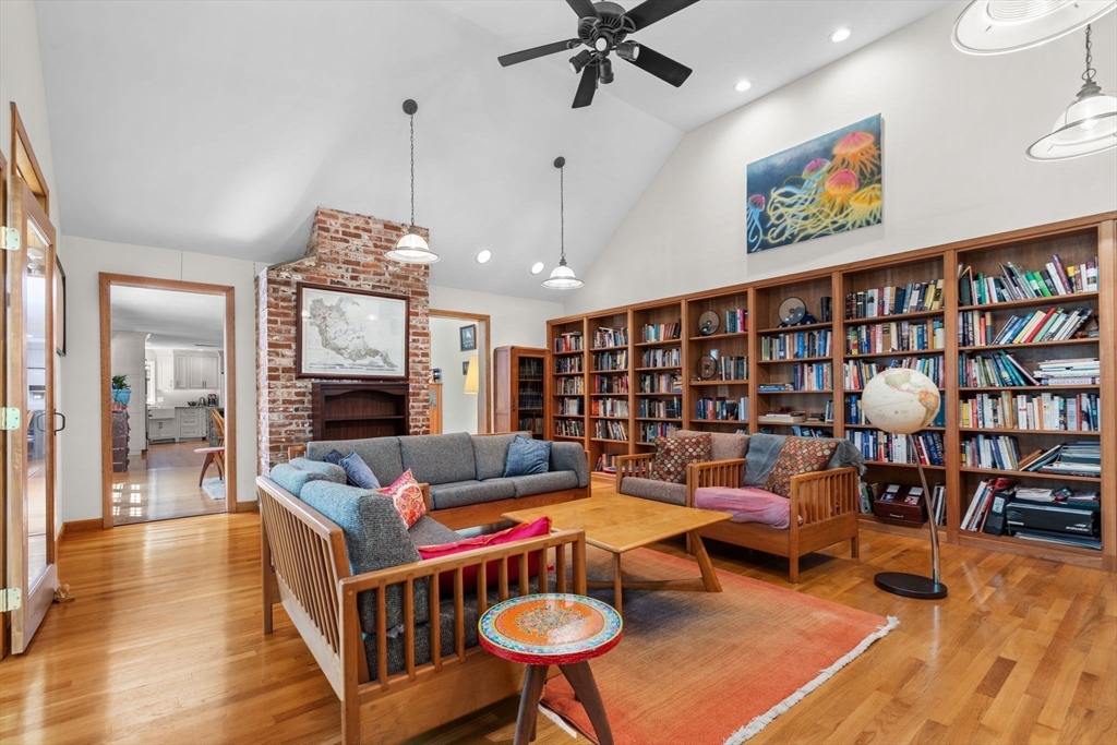 9 Stagecoach Road Princeton, MA 01541 - Photo 15 of 42 a living room with furniture a rug and a book shelf