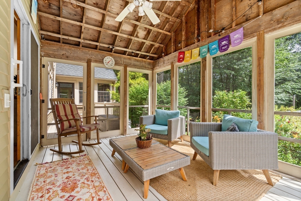9 Stagecoach Road Princeton, MA 01541 - Photo 17 of 42 a living room with furniture and a floor to ceiling window