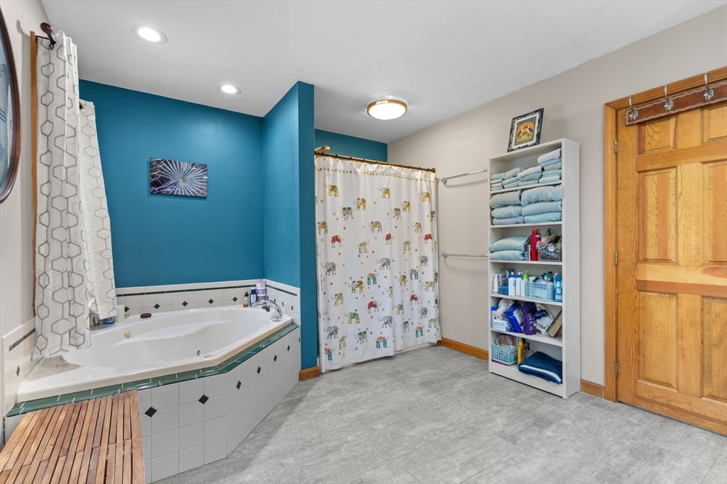 9 Stagecoach Road Princeton, MA 01541 - Photo 23 of 42 a bathroom with a bathtub and a shower