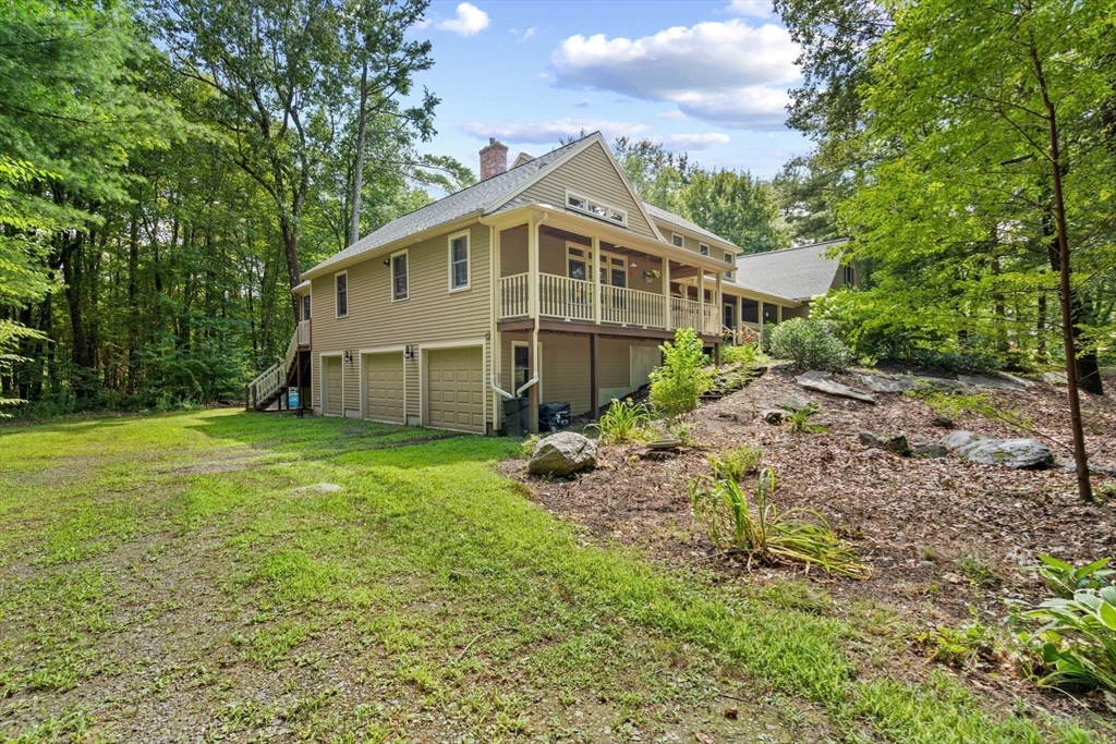 9 Stagecoach Road Princeton, MA 01541 - Photo 30 of 42 a view of a house with backyard and garden