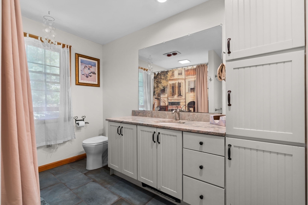 9 Stagecoach Road Princeton, MA 01541 - Photo 37 of 42 a spacious bathroom with a double vanity sink a mirror and a toilet