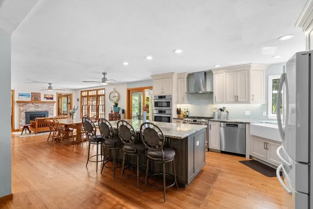 a kitchen with lots of counter top space and stainless steel appliances