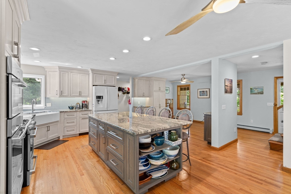 9 Stagecoach Road Princeton, MA 01541 - Photo 9 of 42 a kitchen with stainless steel appliances granite countertop a table chairs refrigerator and sink