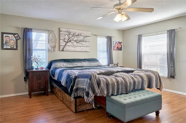 a bedroom with a bed and window