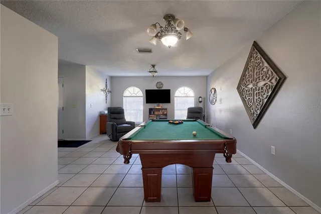 a room with furniture and a flat screen tv