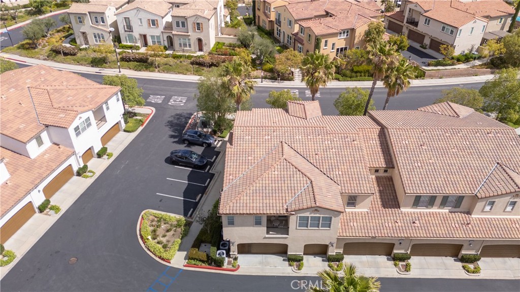 20335 Paseo Meriana Porter Ranch, CA 91326 - Photo 48 of 58 Aerial View of Well-Maintained Exterior with Garage Entry and Driveway
