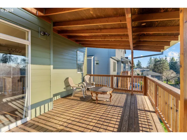 a balcony with wooden floor