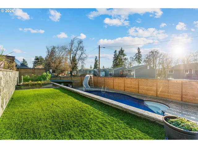 a view of a swimming pool with a lounge chairs