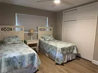 a bedroom with double bed and a window