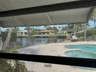a view of swimming pool from a window