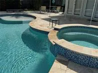 a view of a swimming pool with a sitting area