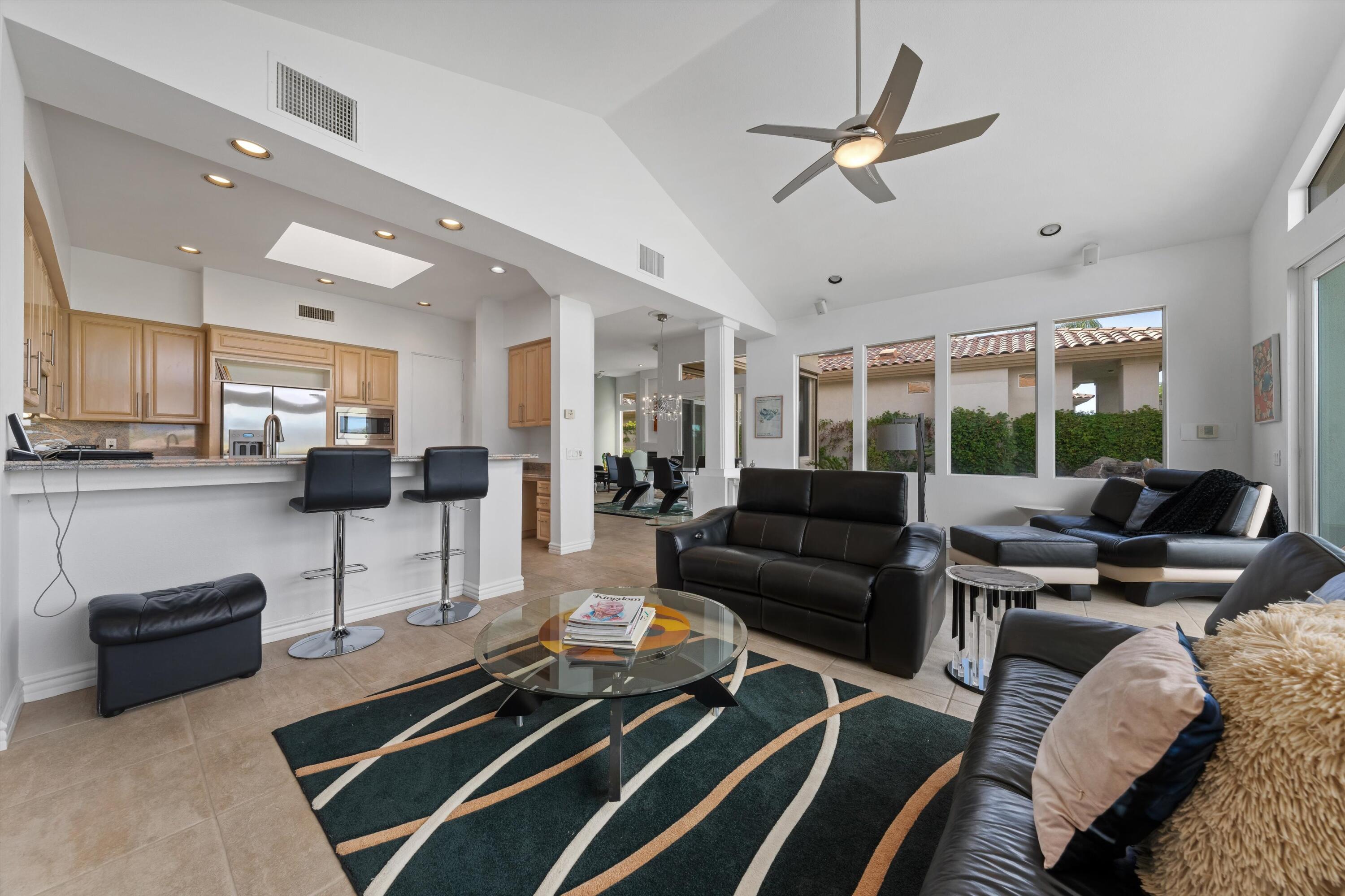 870 Deer Haven Circle Palm Desert, CA 92211 - Photo 15 of 37 a living room with furniture ceiling fan and a rug