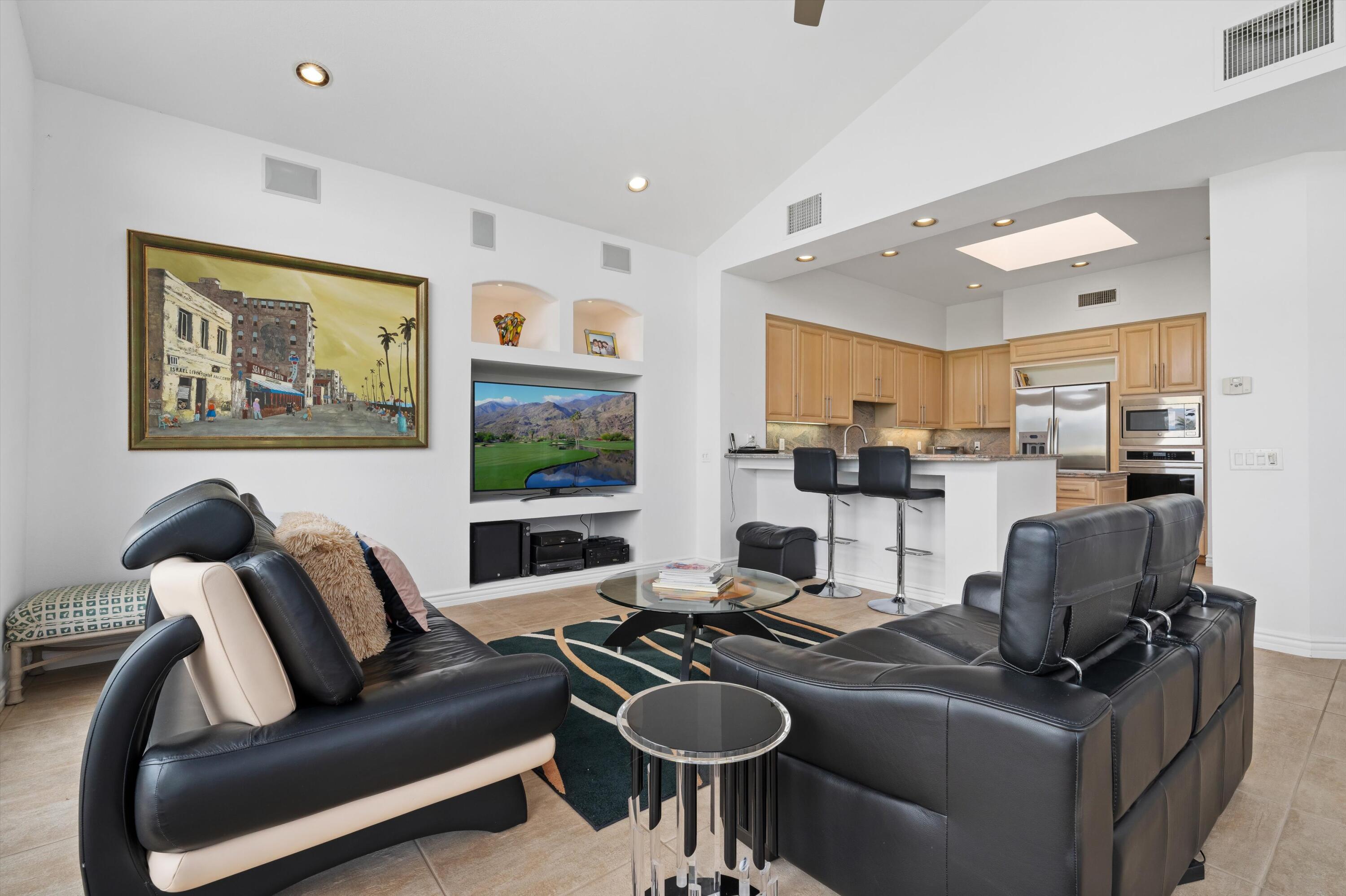 870 Deer Haven Circle Palm Desert, CA 92211 - Photo 17 of 37 a work room with furniture and a flat screen tv