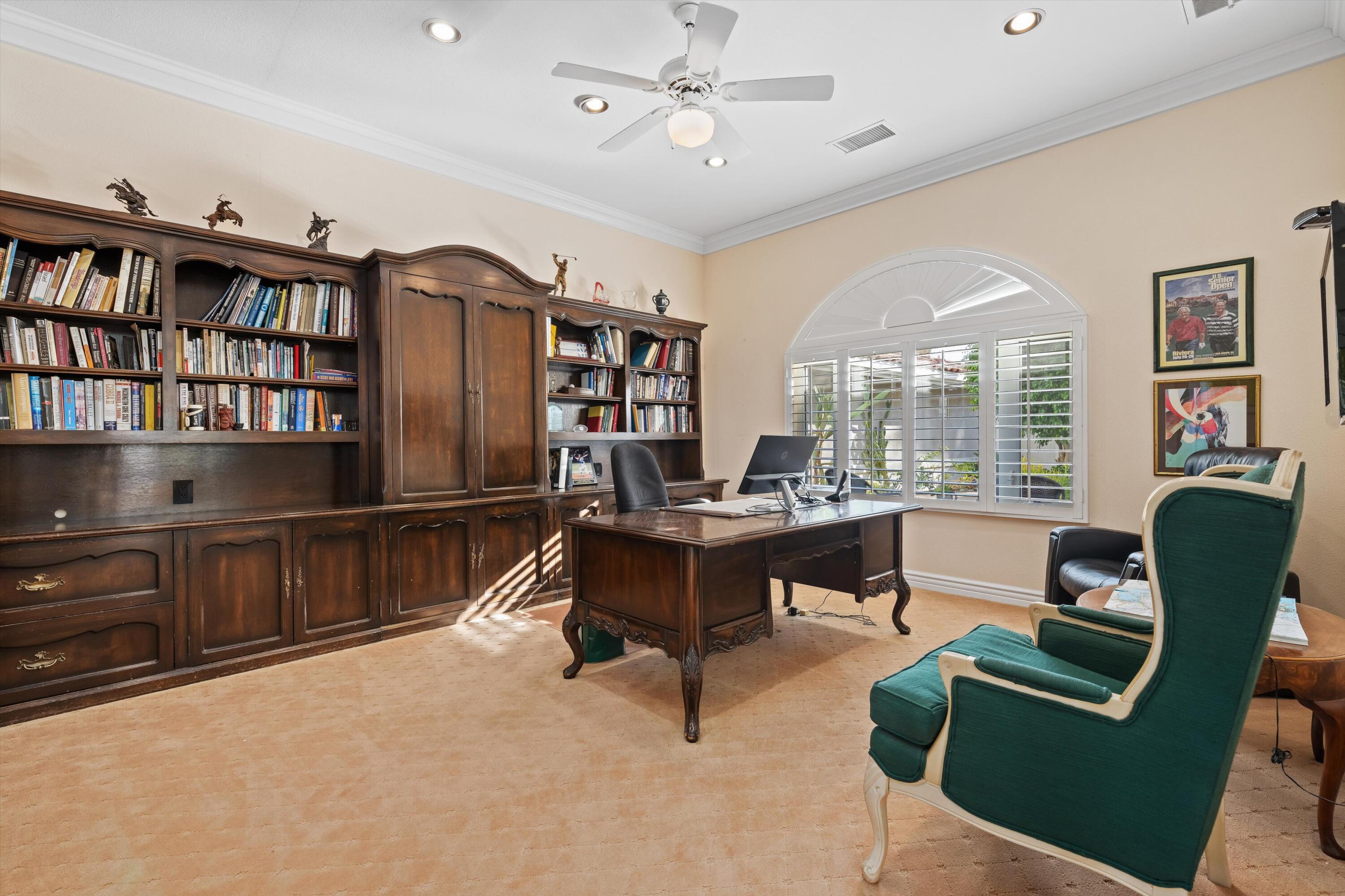 870 Deer Haven Circle Palm Desert, CA 92211 - Photo 21 of 37 a living room with furniture a table and a bookshelf