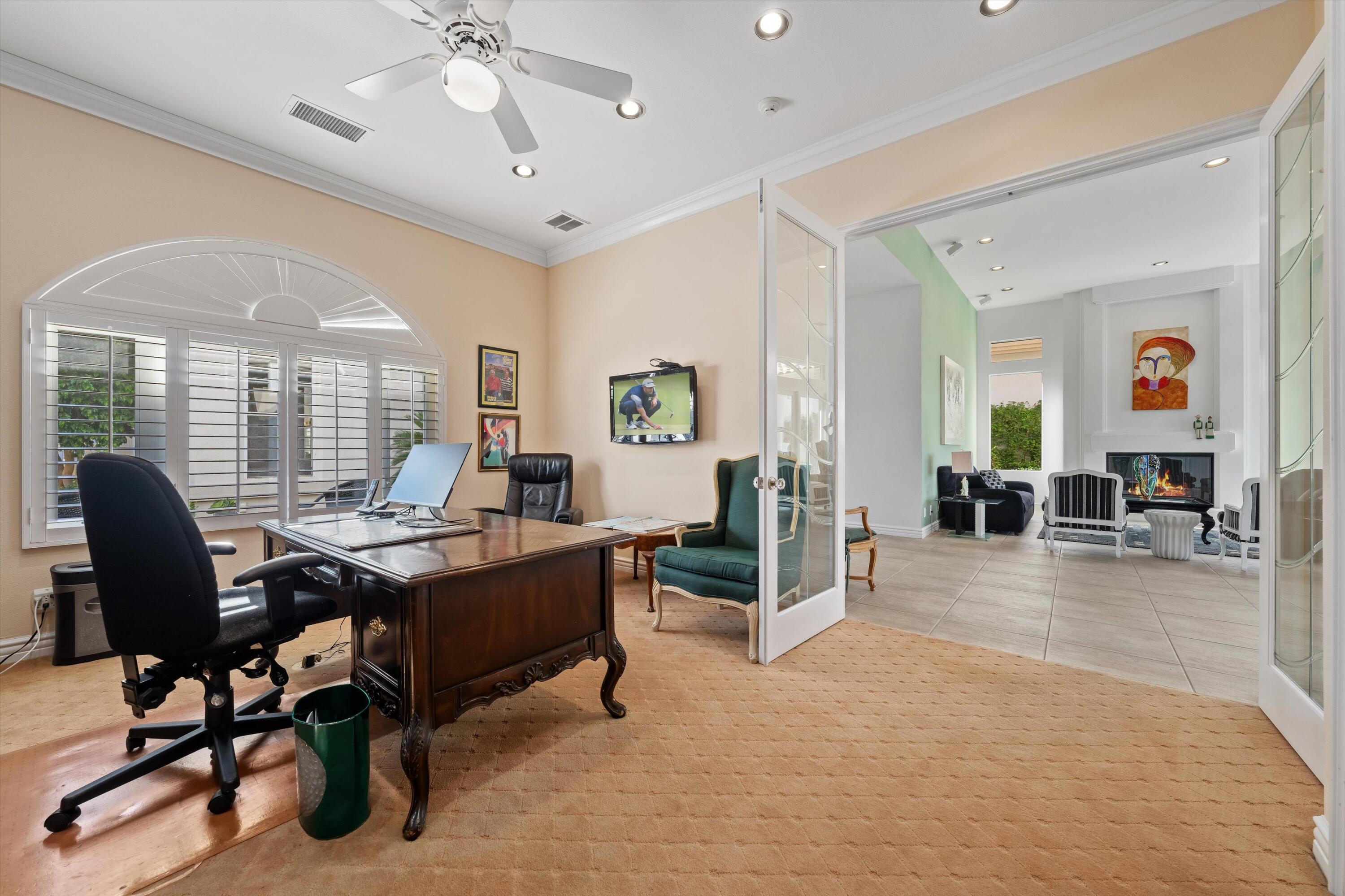 870 Deer Haven Circle Palm Desert, CA 92211 - Photo 22 of 37 a view of a livingroom with workspace and a window