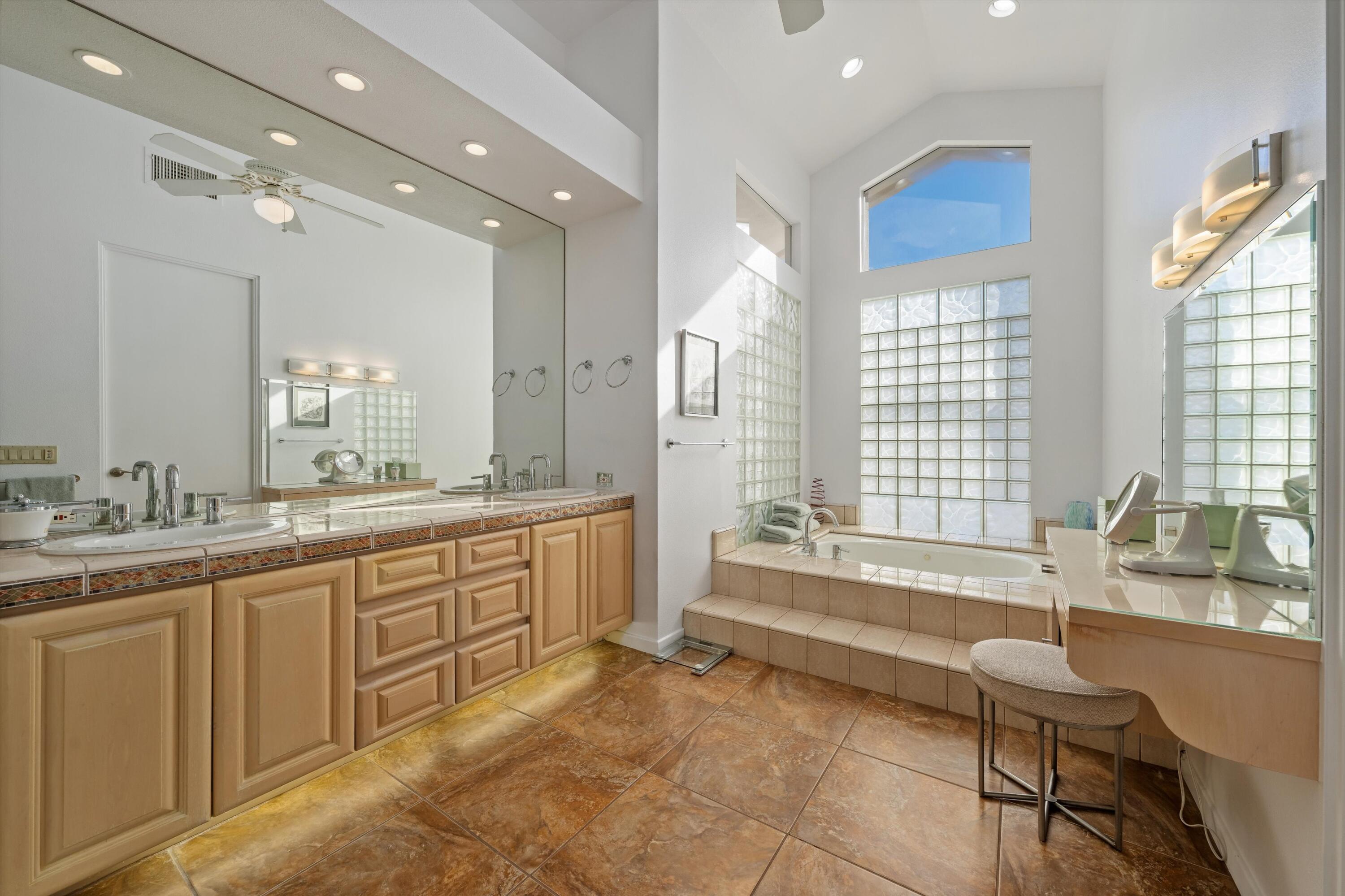 870 Deer Haven Circle Palm Desert, CA 92211 - Photo 26 of 37 a spacious bathroom with a large tub sink and double vanity