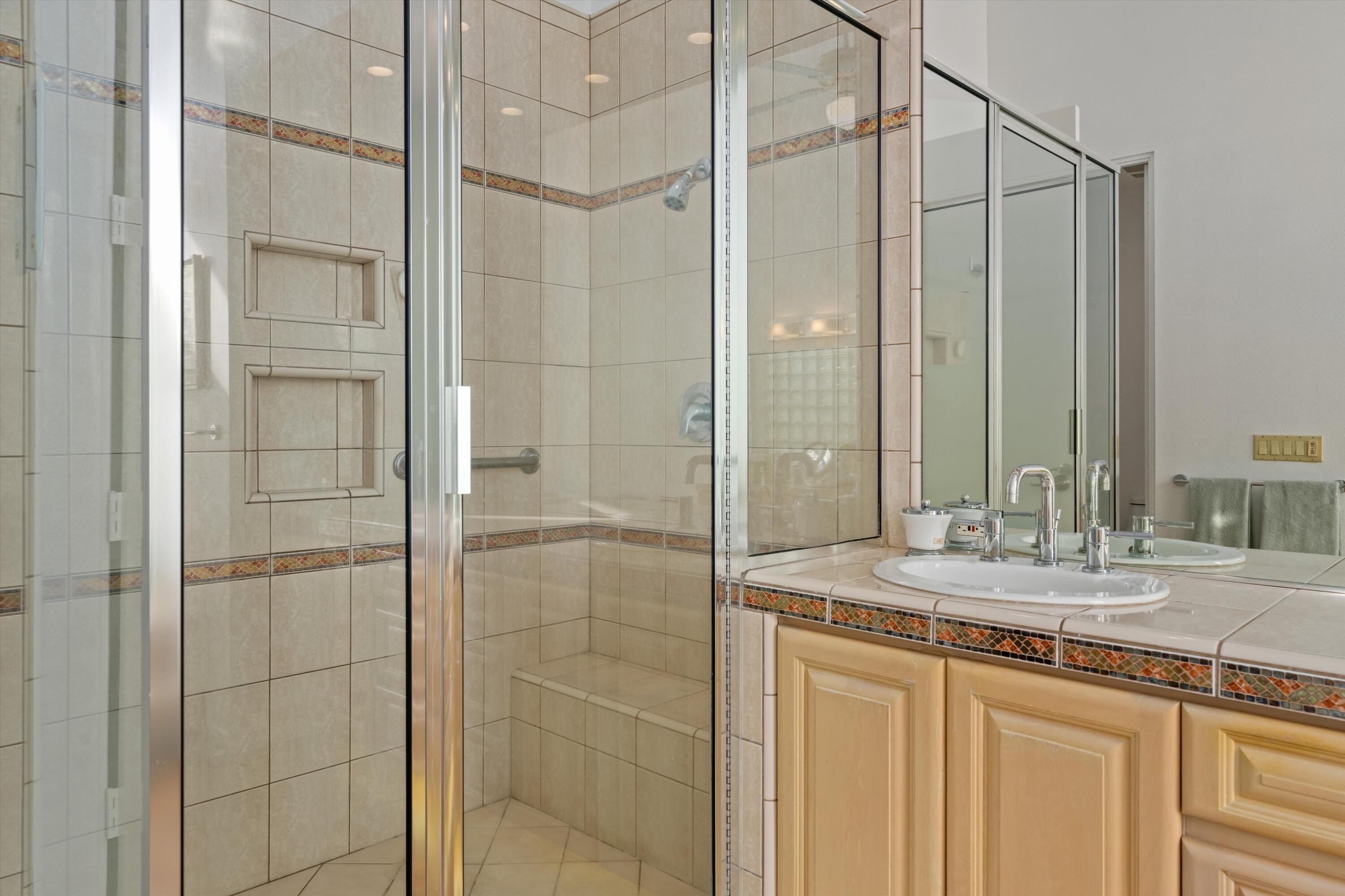 870 Deer Haven Circle Palm Desert, CA 92211 - Photo 27 of 37 a bathroom with a shower and a sink
