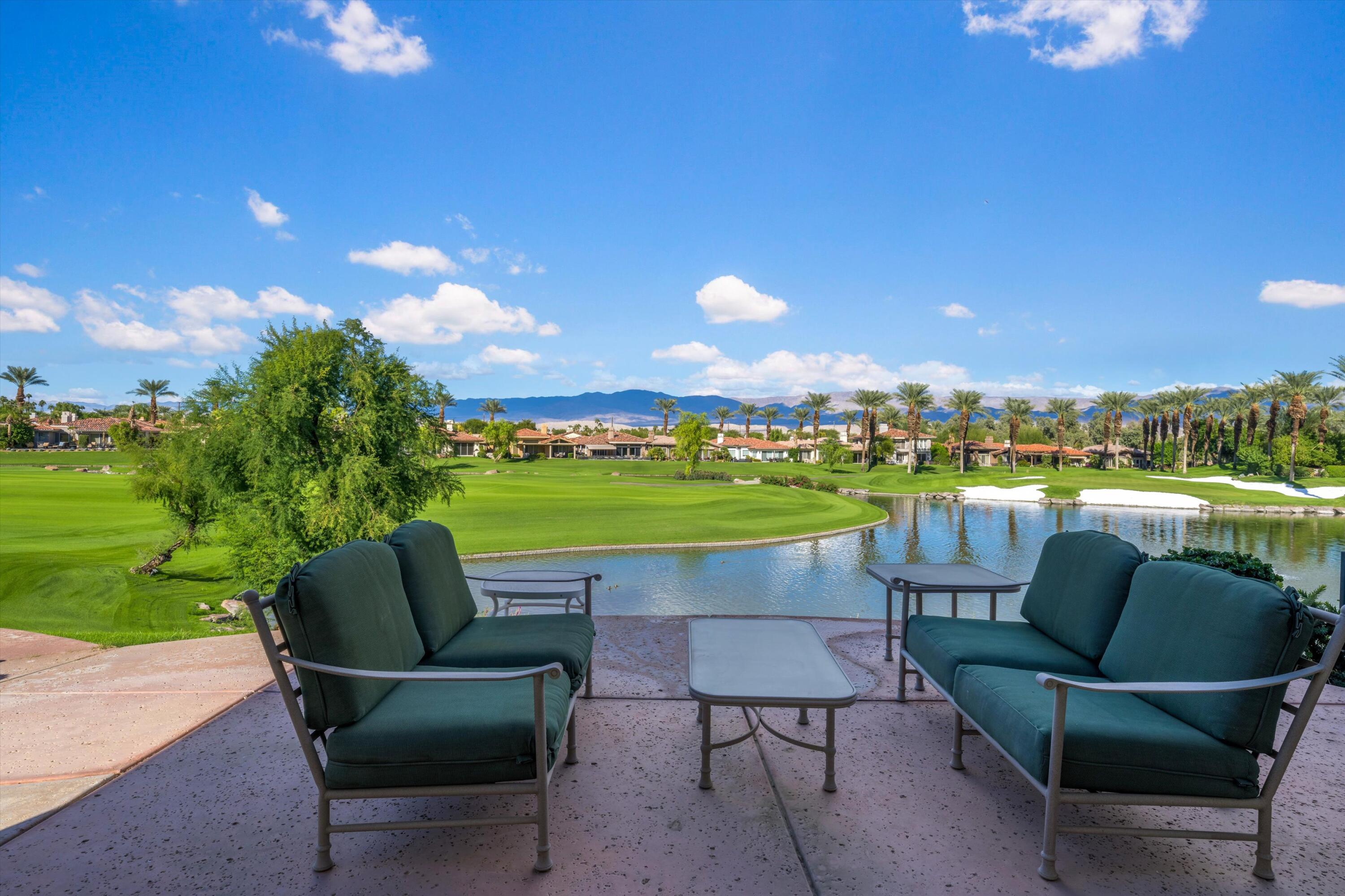 870 Deer Haven Circle Palm Desert, CA 92211 - Photo 3 of 37 a view of patio with couches potted plants and a big yard