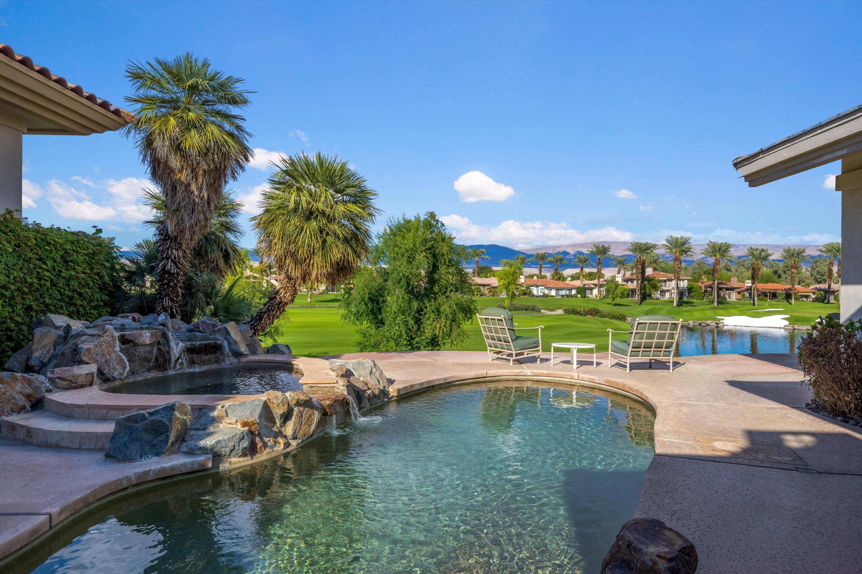 870 Deer Haven Circle Palm Desert, CA 92211 - Photo 33 of 37 a view of a swimming pool with a patio