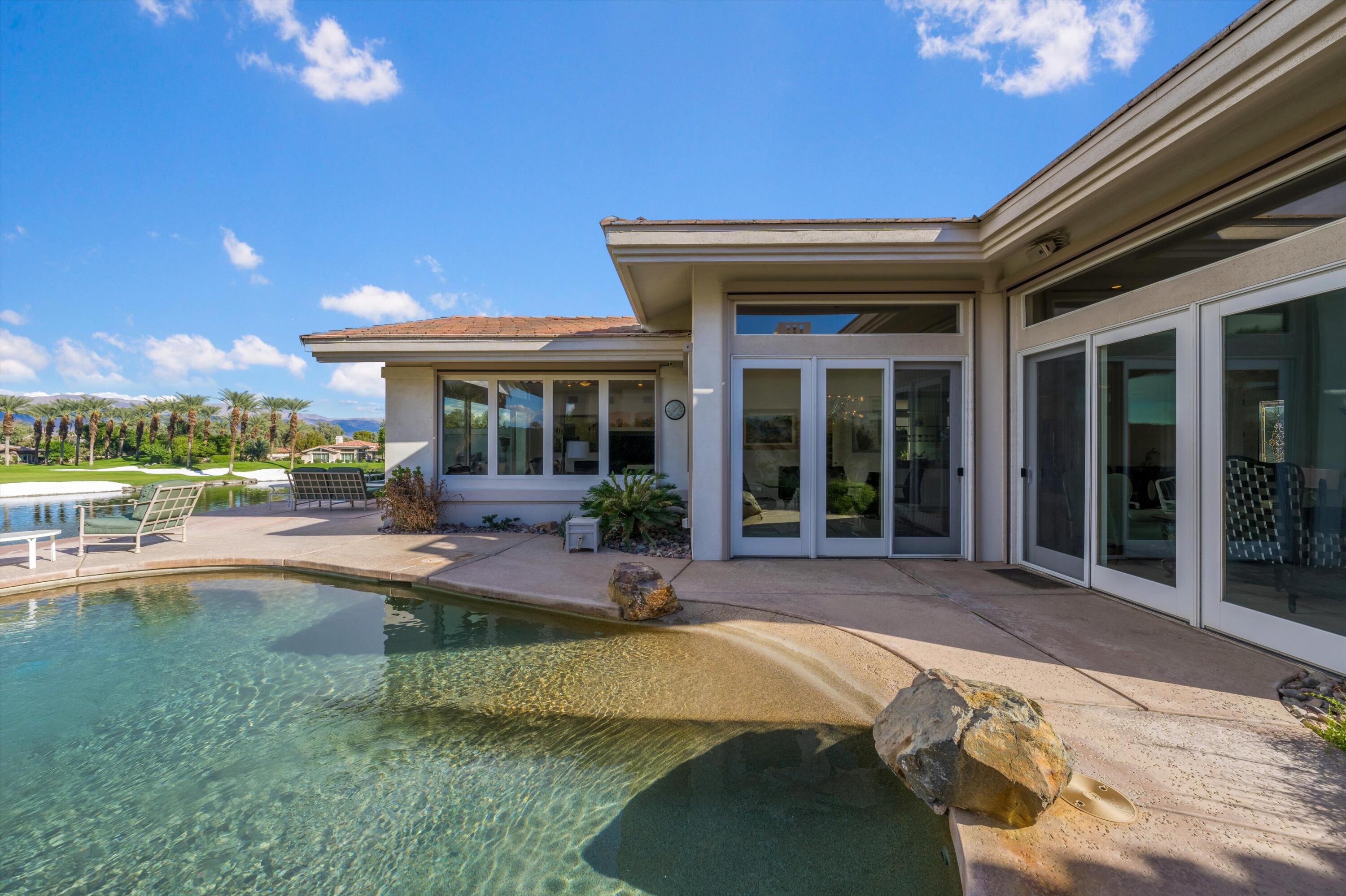 870 Deer Haven Circle Palm Desert, CA 92211 - Photo 35 of 37 a view of a house with backyard porch and sitting area