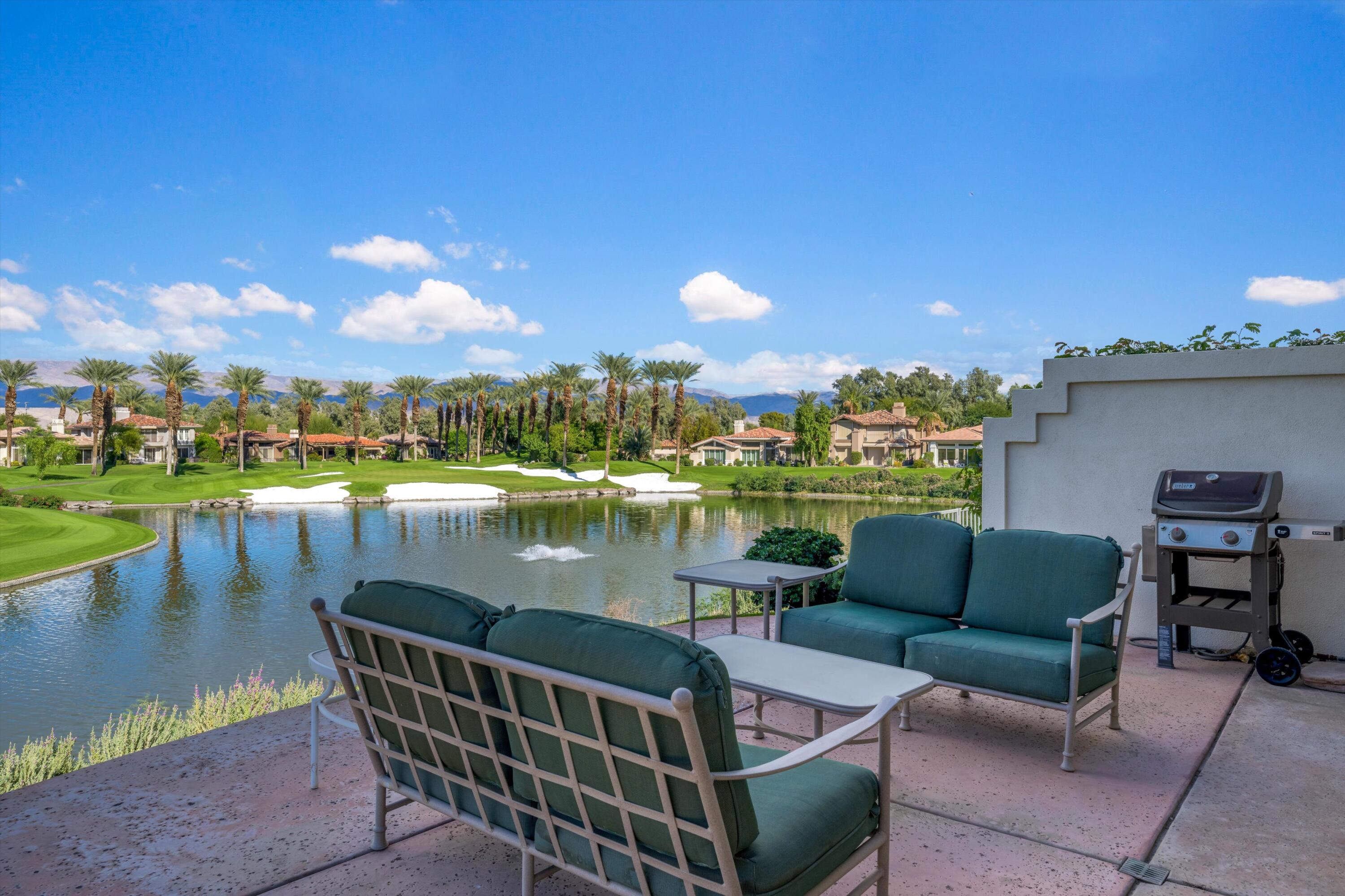 870 Deer Haven Circle Palm Desert, CA 92211 - Photo 36 of 37 a view of a lake from a balcony