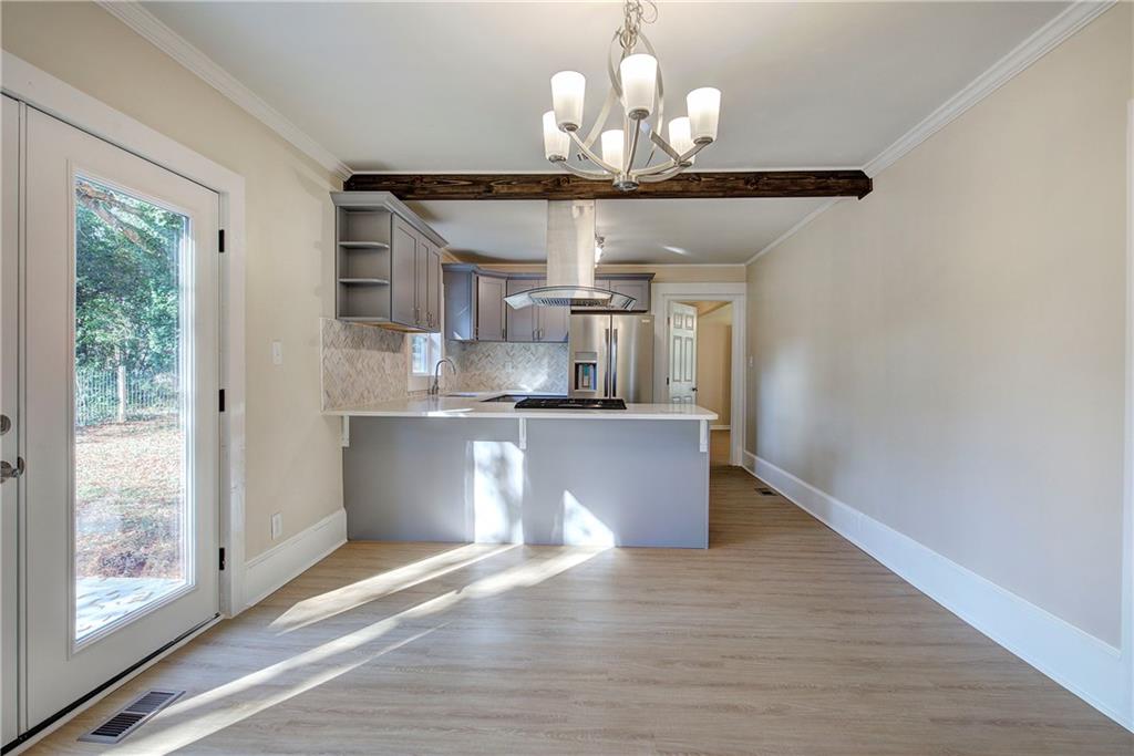 415 East 10th Street Rome, GA 30161 - Photo 18 of 42 a view of a kitchen from the hallway