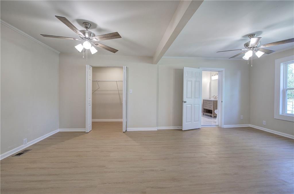 415 East 10th Street Rome, GA 30161 - Photo 24 of 42 a view of an empty room with chandelier fan and a window