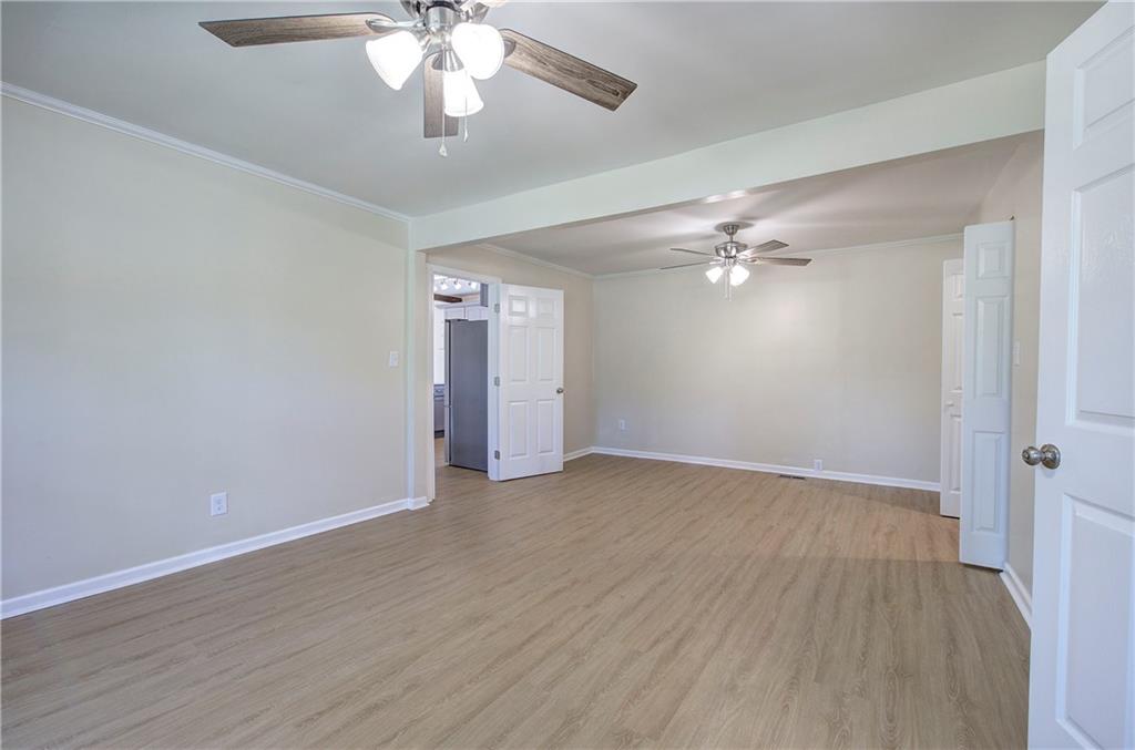 415 East 10th Street Rome, GA 30161 - Photo 28 of 42 a view of an empty room with wooden floor