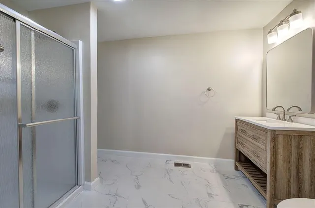 a bathroom with a sink and mirror