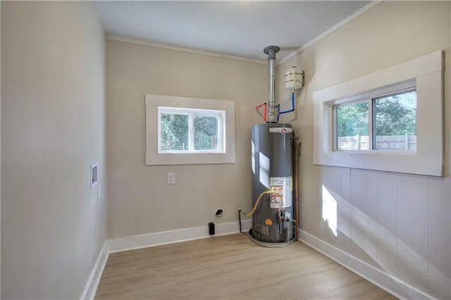 a view of a room with gym equipment and a window