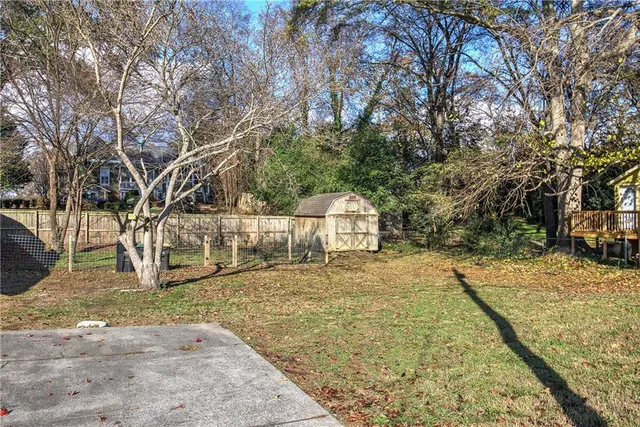 a view of a yard with trees