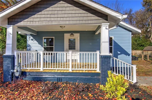 a front view of a house with a porch