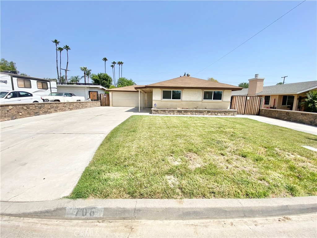 706 Kemp Street Riverside, CA 92501 - Photo 1 of 1 a front view of a house with a yard