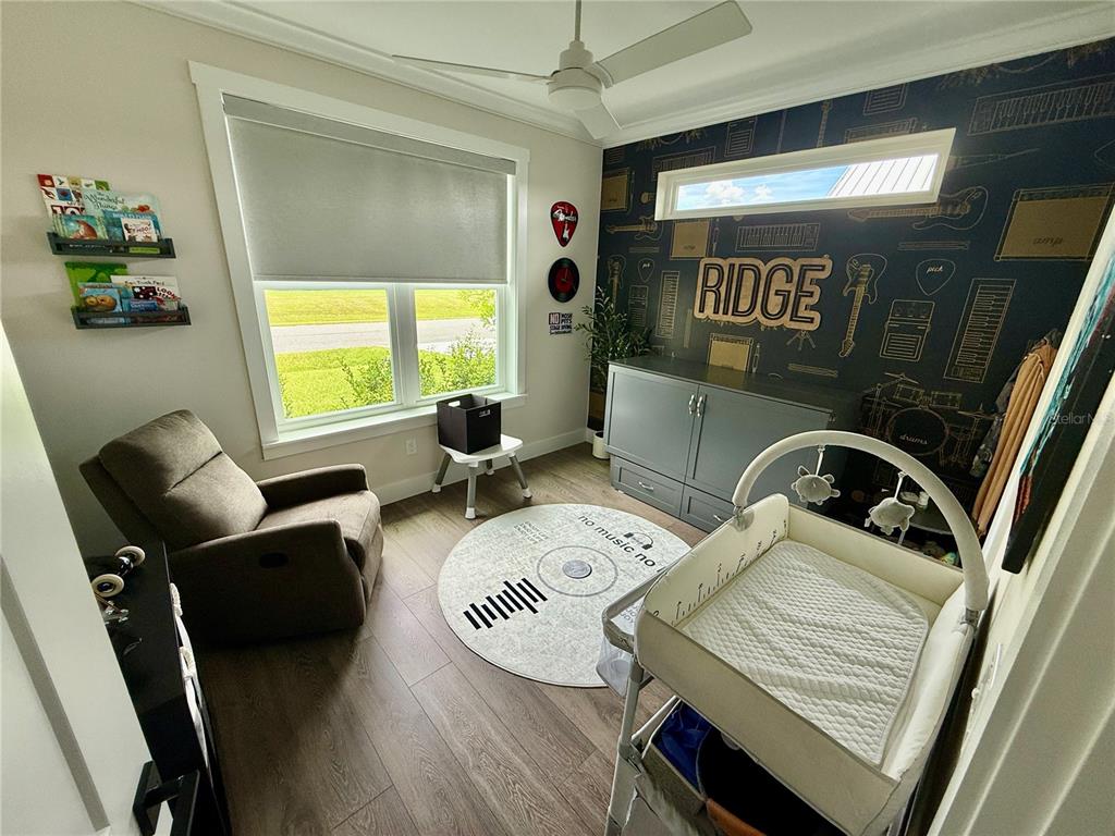 12030 Lakeshore Way Oxford, FL 34484 - Photo 11 of 38 a view of a workspace with furniture and a window