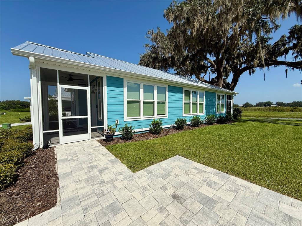 12030 Lakeshore Way Oxford, FL 34484 - Photo 19 of 38 a view of a house with a garden