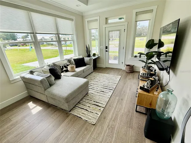 a living room with furniture and a window