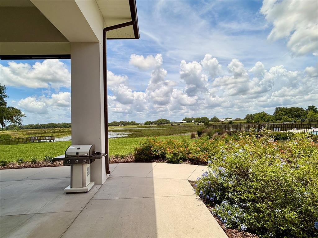 12030 Lakeshore Way Oxford, FL 34484 - Photo 32 of 38 a view of a garden with an outdoor seating
