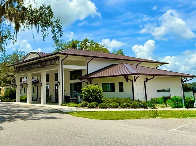 front view of a house with a garden