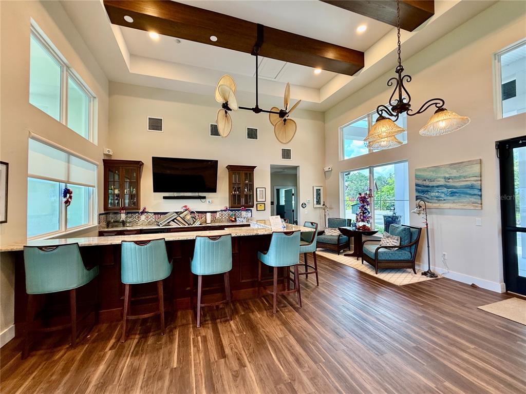 12030 Lakeshore Way Oxford, FL 34484 - Photo 36 of 38 a view of a dining room with furniture window and wooden floor