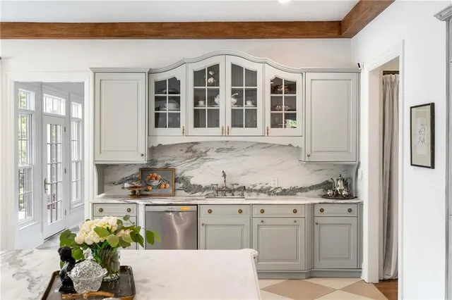 a living room with furniture a window and a fireplace