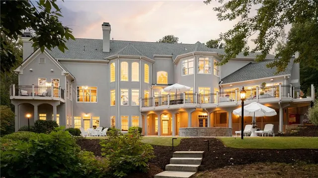 a front view of a residential apartment building with a yard