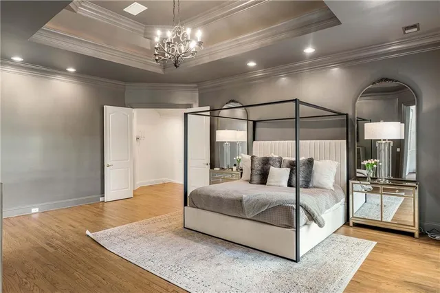 a bedroom with a bed and a walk in closet
