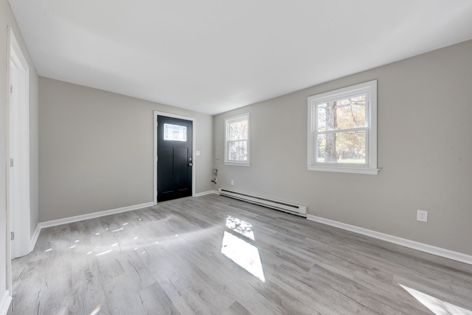62 Rice Road East Windsor, CT 06016 - Photo 11 of 18 a view of an empty room with wooden floor and a window