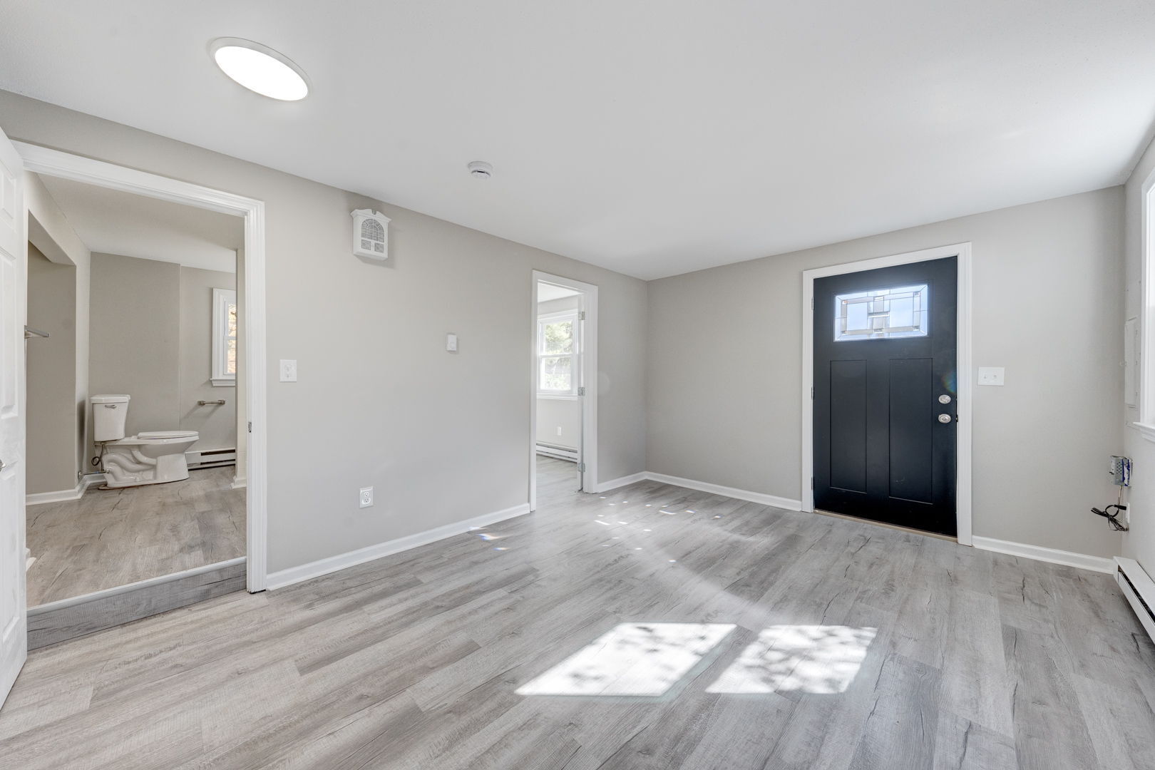 62 Rice Road East Windsor, CT 06016 - Photo 12 of 18 an empty room with wooden floor and bathroom view