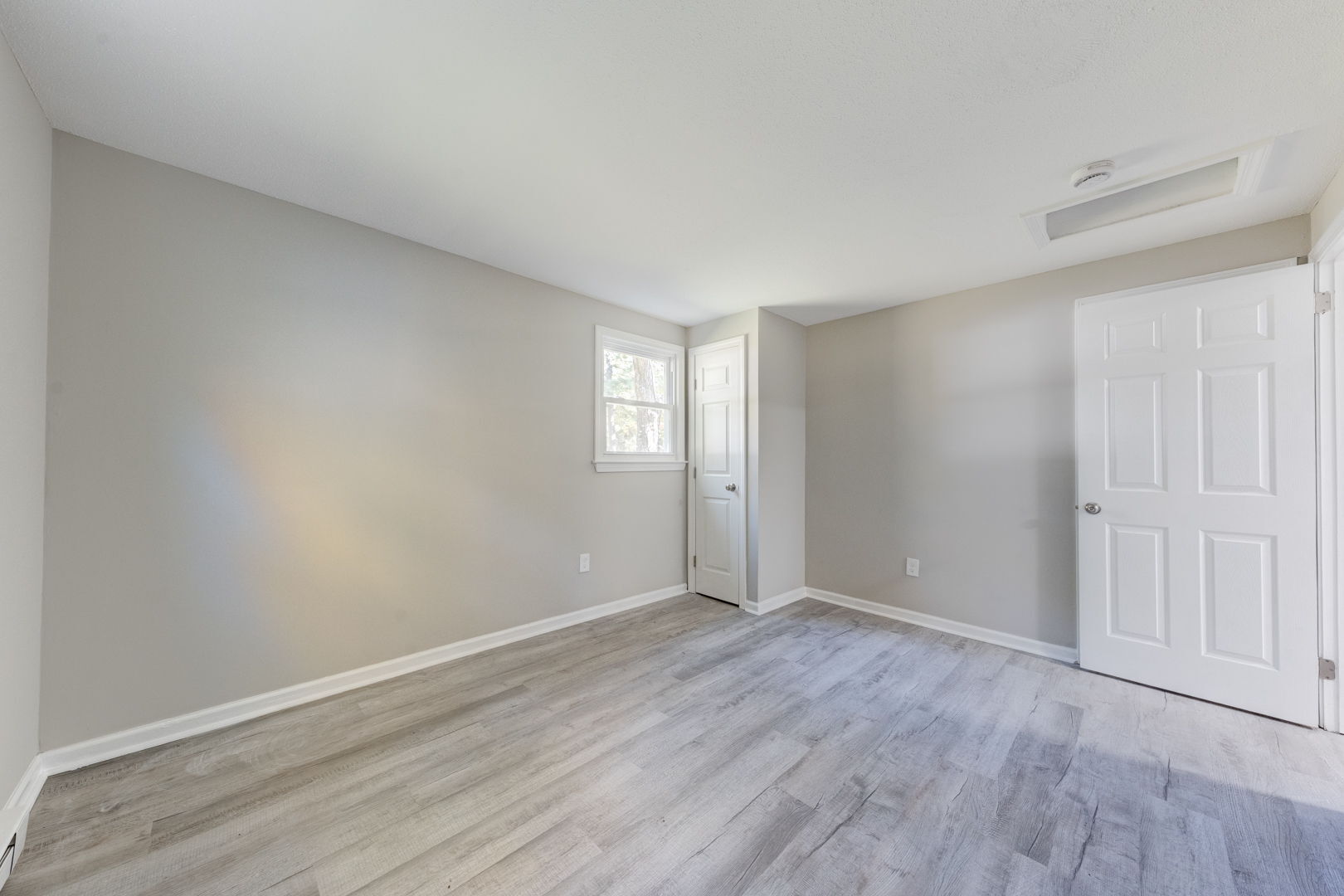 62 Rice Road East Windsor, CT 06016 - Photo 13 of 18 a view of an empty room with wooden floor and window