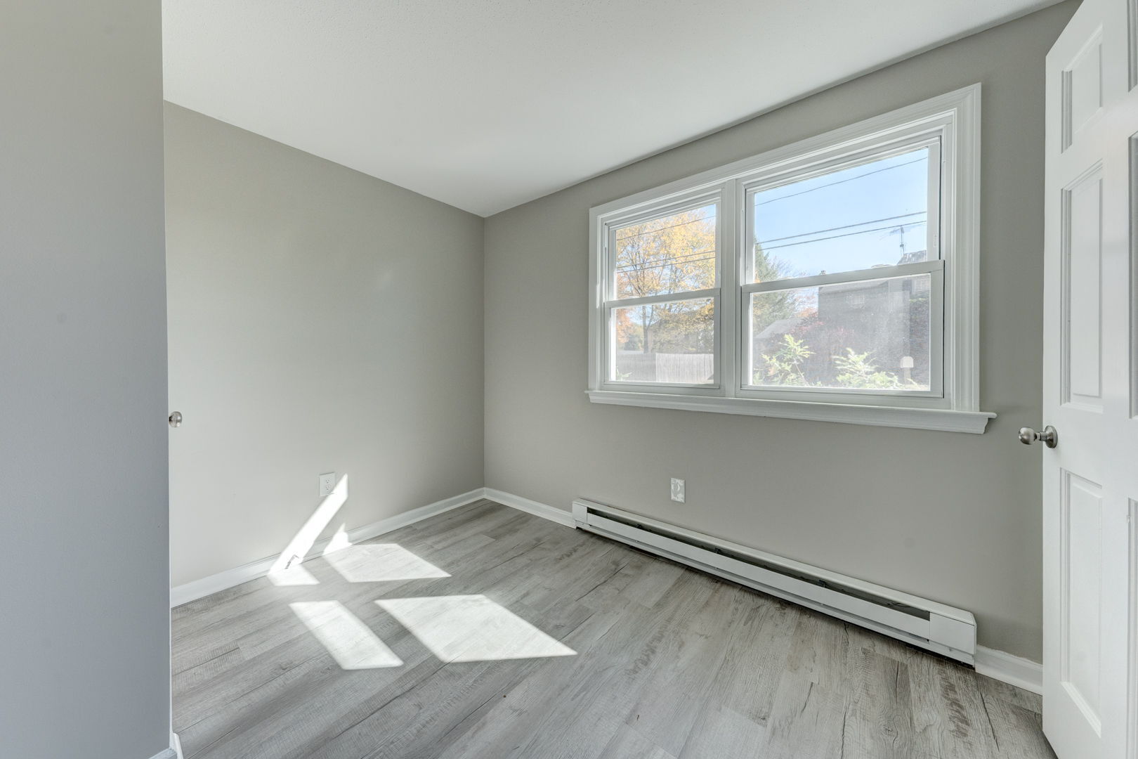 62 Rice Road East Windsor, CT 06016 - Photo 16 of 18 an empty room with wooden floor and windows